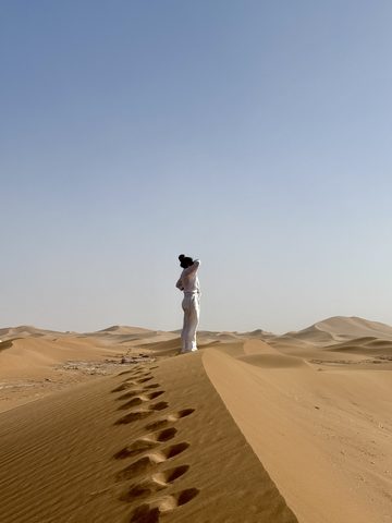 Standing on a dune ridge in the desert